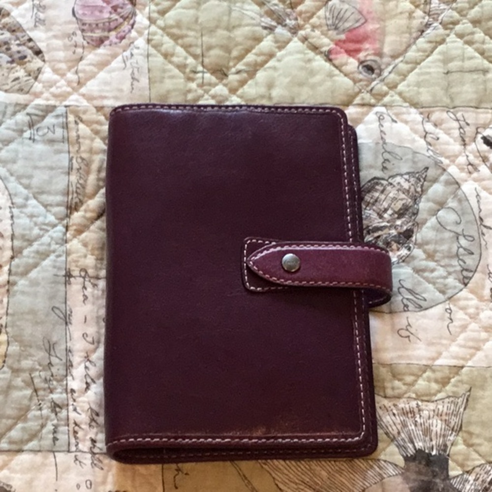Filofax personal organizer, purple, with inserts.